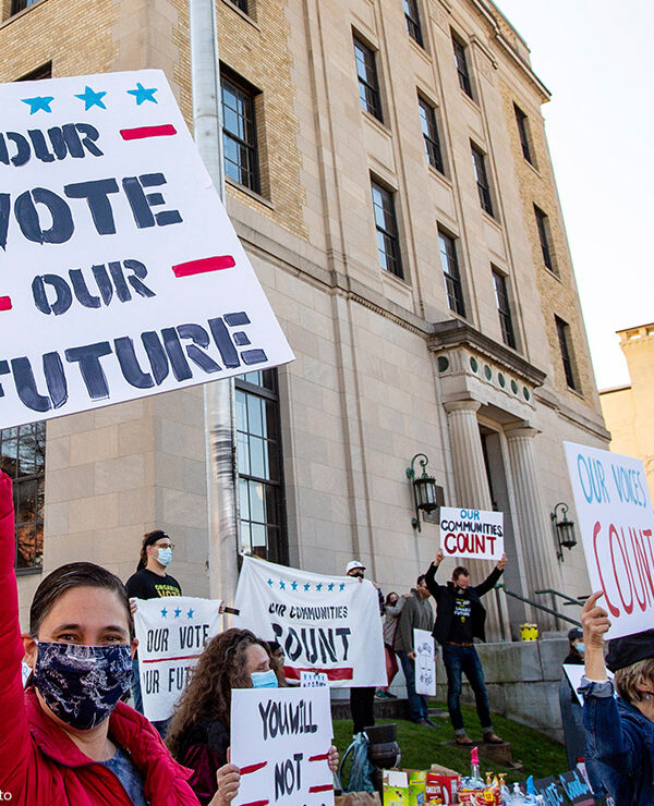 Dozens of people gathered near the Post Office in Lewisburg, Pennsylvania, holding signs that read "Our Vote Our Future" and "Our Voices Count," to celebrate the election of Joe Biden.