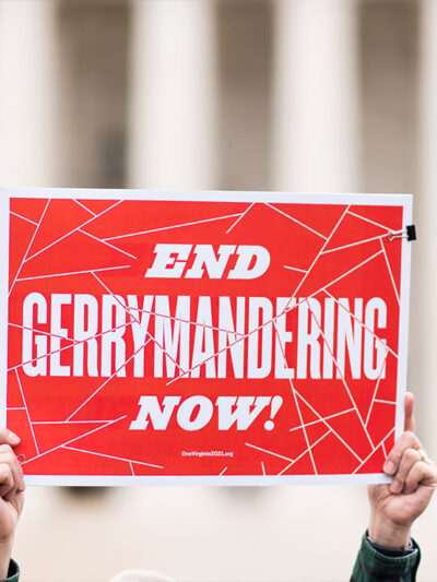 Gerrymandering activists gather on the steps of the Supreme Court as the court prepares to hear the the Benisek v. Lamone case on Wednesday, March 28, 2018.