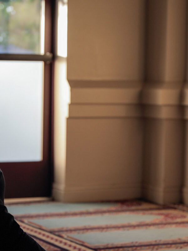 Ali Malik praying in a mosque